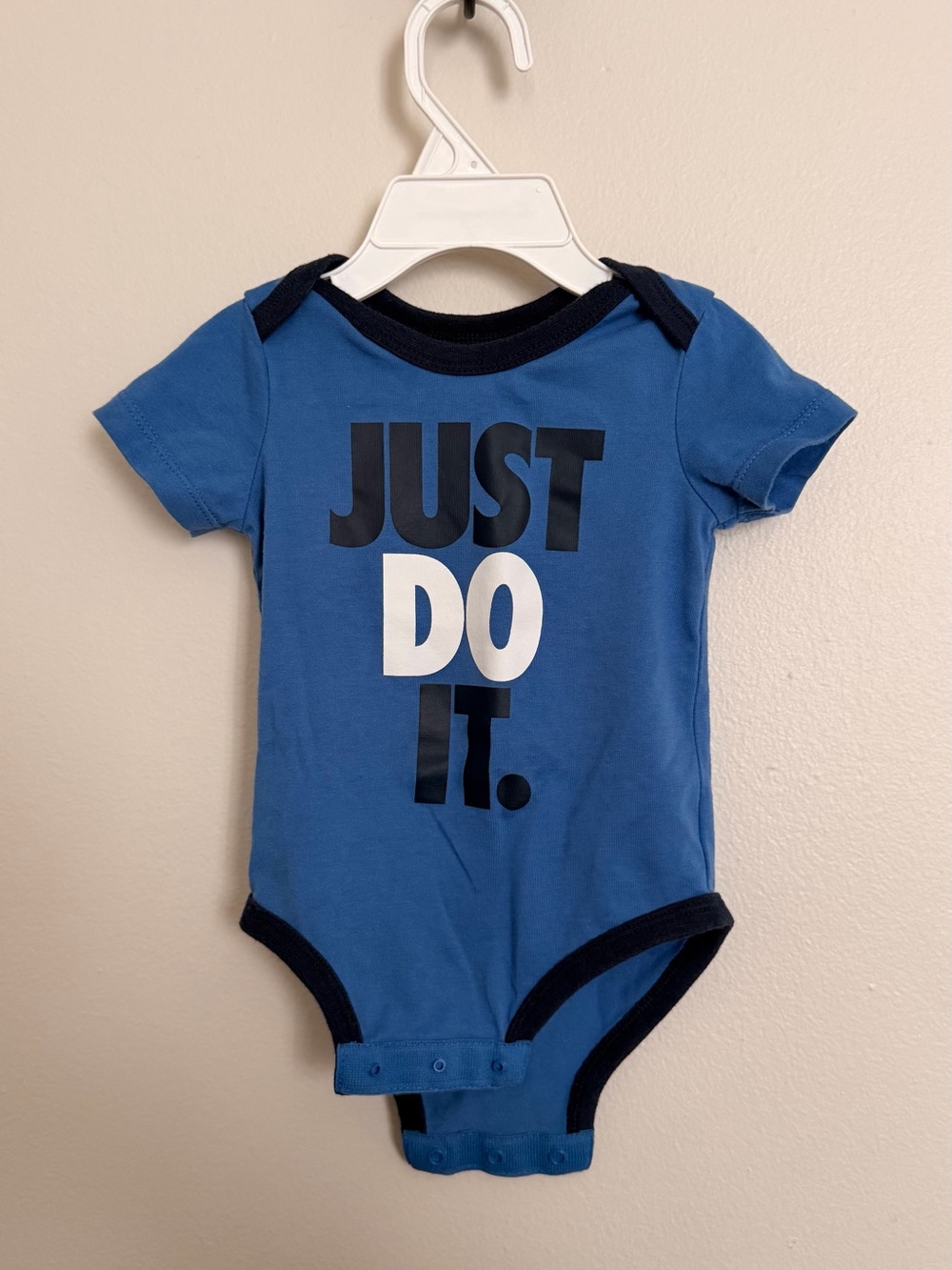 Nike Blue Short-Sleeve Baby One-Piece with 'Just Do It.' Graphic